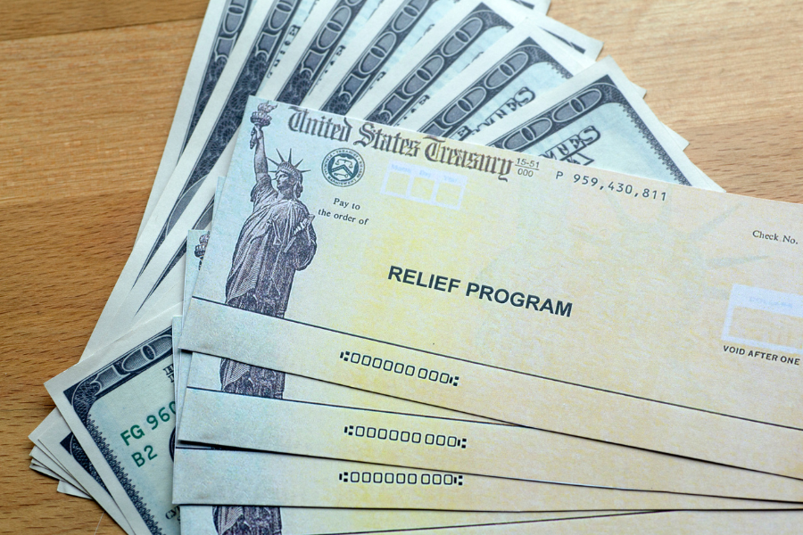 A stack of United States Treasury checks to the order of "Relief Programs"