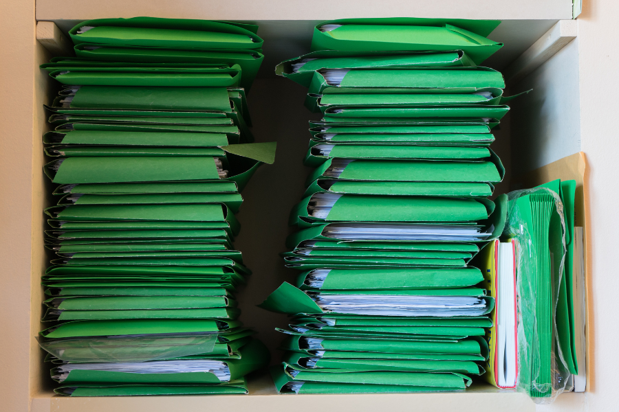 A stack of green file folders.
